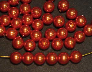 Glasperlen rund
 mit Wachsüberzug
 rotgold, 
 hergestellt in Gablonz / Tschechien